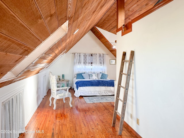 bedroom featuring hardwood / wood-style flooring, wood ceiling, and vaulted ceiling