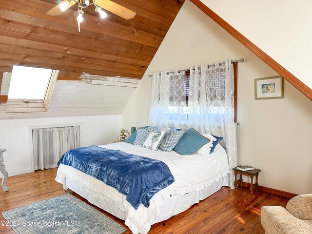 bedroom with ceiling fan, wood-type flooring, lofted ceiling, and wood ceiling