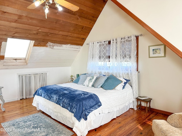 5875 Riverside Dr, Melbourne Beach, FL 32951 - bedroom featuring lofted ceiling, wood finished floors, a ceiling fan, and baseboards