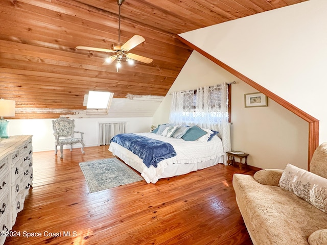 5875 Riverside Dr, Melbourne Beach, FL 32951 - bedroom featuring lofted ceiling, wooden ceiling, radiator, wood finished floors, and a ceiling fan