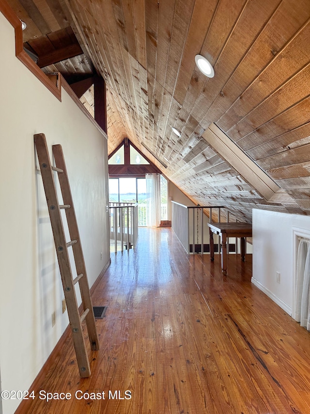 bonus room with hardwood / wood-style floors, wood ceiling, and vaulted ceiling