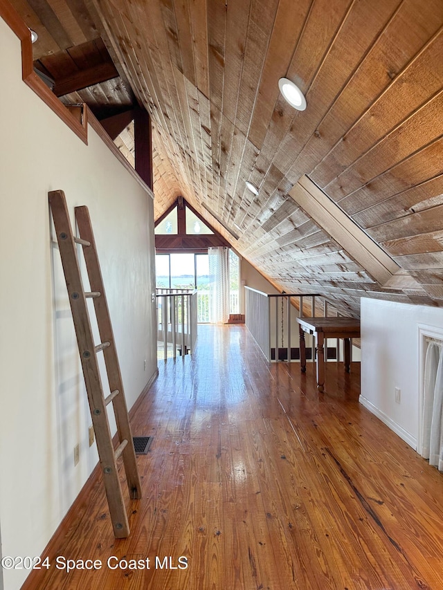 5875 Riverside Dr, Melbourne Beach, FL 32951 - additional living space with wood-type flooring, vaulted ceiling, wooden ceiling, and baseboards