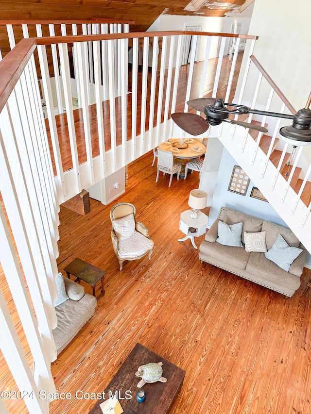 5875 Riverside Dr, Melbourne Beach, FL 32951 - living area with stairway and hardwood / wood-style flooring