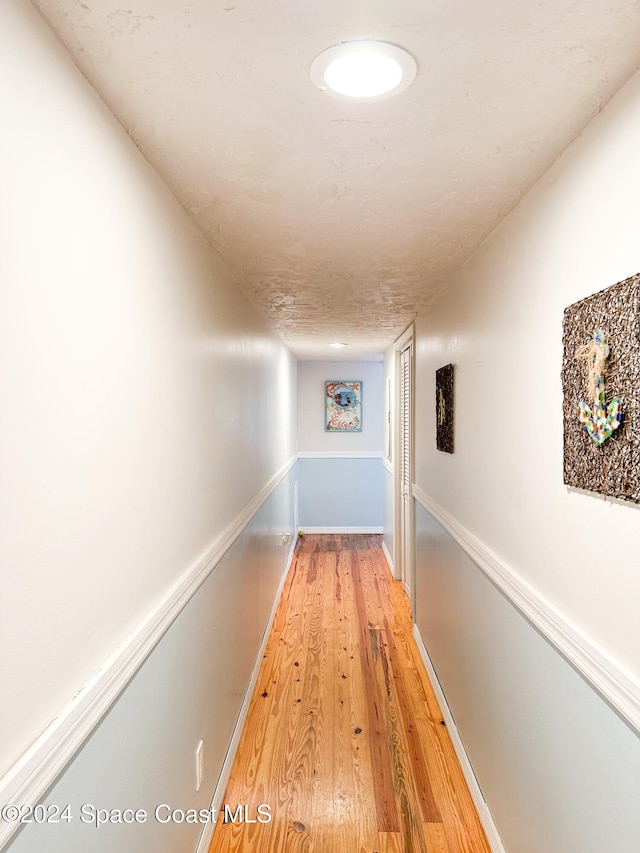 corridor featuring light hardwood / wood-style flooring