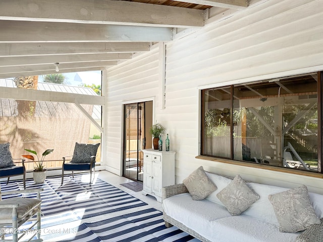 5875 Riverside Dr, Melbourne Beach, FL 32951 - sunroom featuring beam ceiling