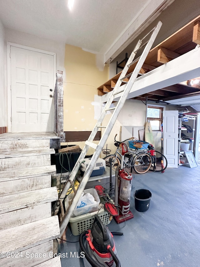 stairs with concrete flooring