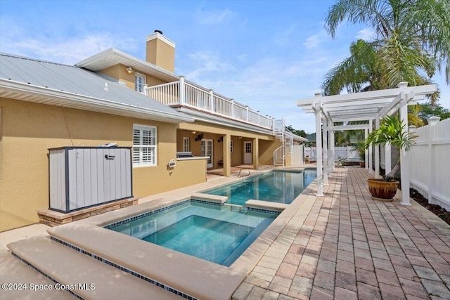 view of swimming pool with a pergola, an in ground hot tub, and a patio