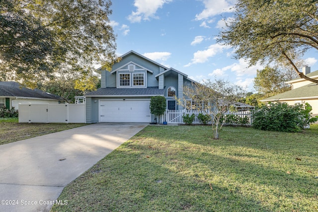 view of front facade with a front yard and a garage