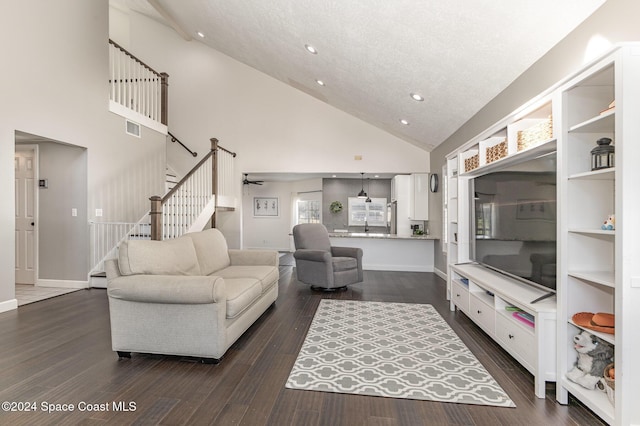 1010 Citrus Ave NE, Palm Bay, FL 32905 - living area featuring high vaulted ceiling, stairway, recessed lighting, and dark wood-style flooring