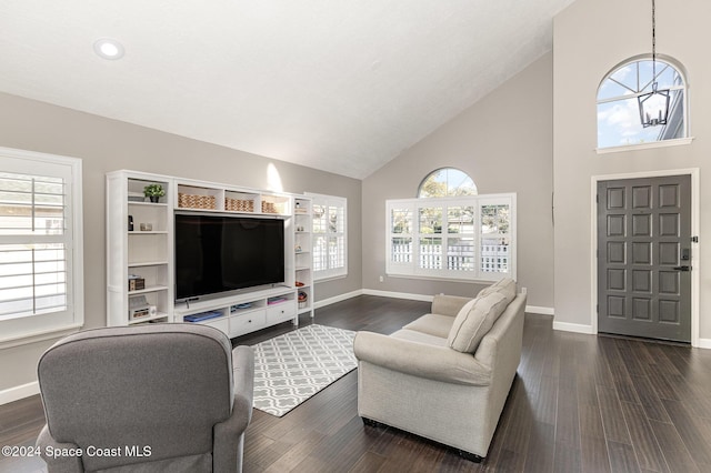 1010 Citrus Ave NE, Palm Bay, FL 32905 - living room with high vaulted ceiling, dark wood-style flooring, and recessed lighting