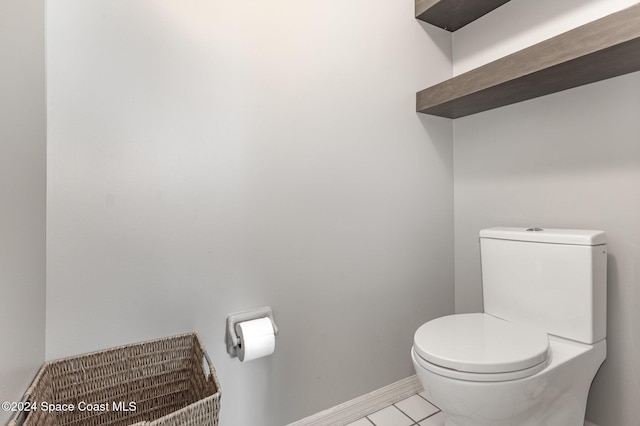 1010 Citrus Ave NE, Palm Bay, FL 32905 - bathroom with toilet and tile patterned floors