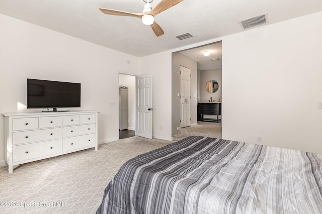1010 Citrus Ave NE, Palm Bay, FL 32905 - bedroom with light colored carpet and a ceiling fan