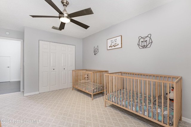 1010 Citrus Ave NE, Palm Bay, FL 32905 - carpeted bedroom with a closet and ceiling fan