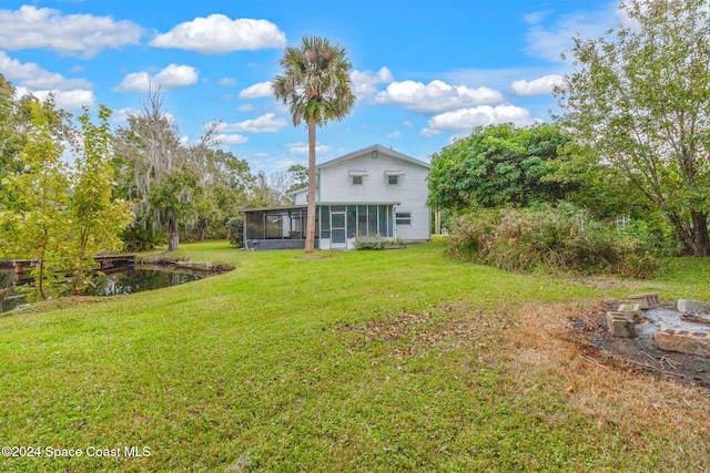 view of yard with a sunroom