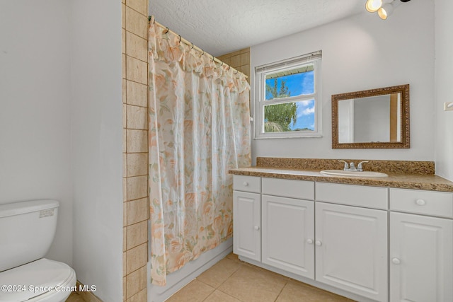 full bathroom with shower / bath combo, a textured ceiling, vanity, tile patterned flooring, and toilet