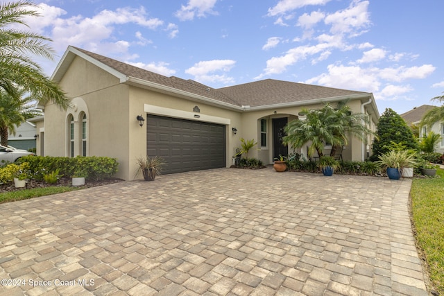 view of front of home with a garage