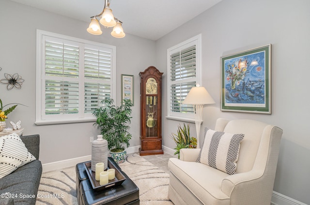 living area with a notable chandelier