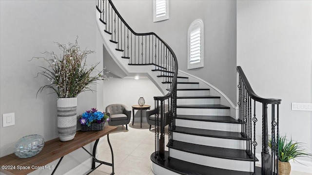 stairs with tile patterned floors