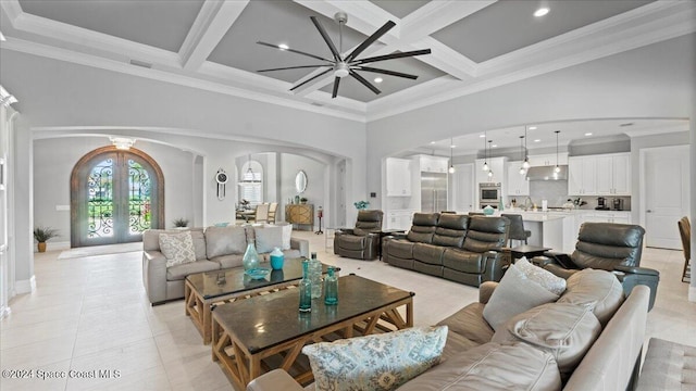 tiled living room with beam ceiling, ornamental molding, and coffered ceiling