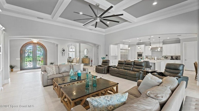 4695 Tea Tree Ct, Rockledge, FL 32955 - living area featuring arched walkways, beam ceiling, a high ceiling, light tile patterned floors, and coffered ceiling