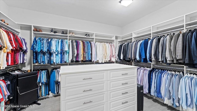 4695 Tea Tree Ct, Rockledge, FL 32955 - walk in closet featuring light tile patterned flooring
