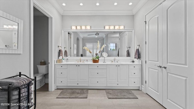 4695 Tea Tree Ct, Rockledge, FL 32955 - bathroom with crown molding, double vanity, recessed lighting, and ceiling fan