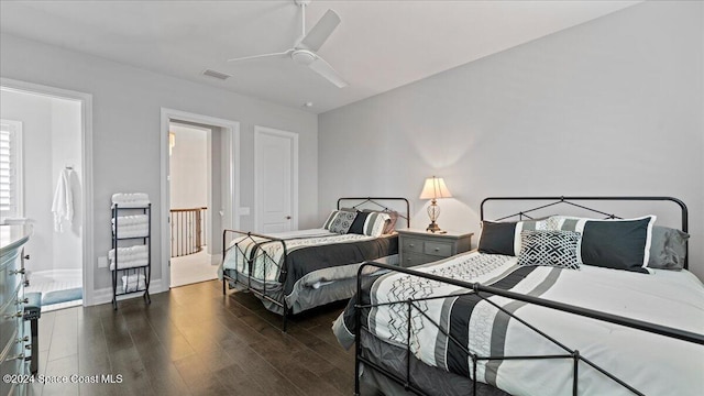 bedroom with dark hardwood / wood-style floors and ceiling fan