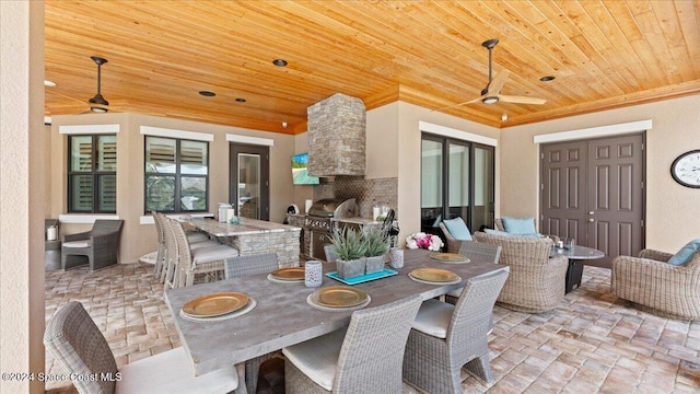 dining area with ceiling fan and wooden ceiling