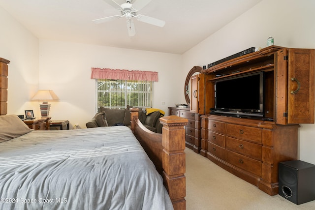 bedroom with ceiling fan and light colored carpet