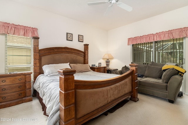 bedroom featuring access to exterior, ceiling fan, and light colored carpet