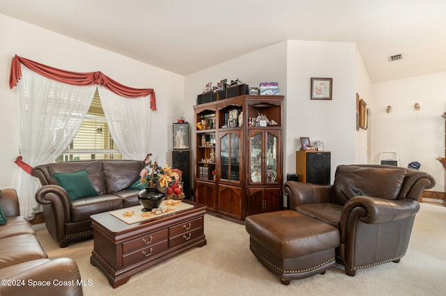 living room with light carpet and lofted ceiling