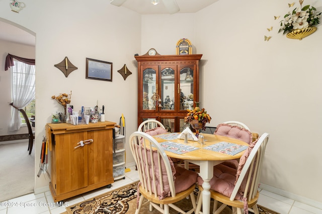 tiled dining room with ceiling fan