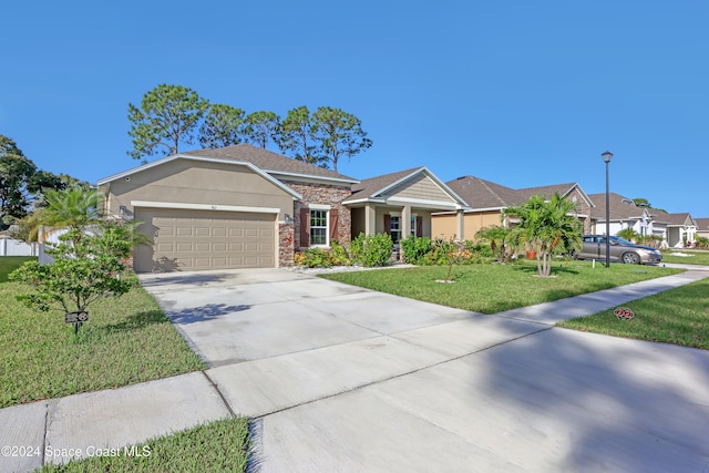 ranch-style house with a garage and a front yard