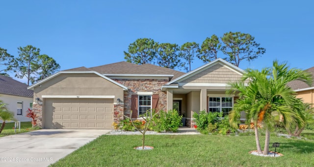 view of front of property featuring a garage and a front lawn