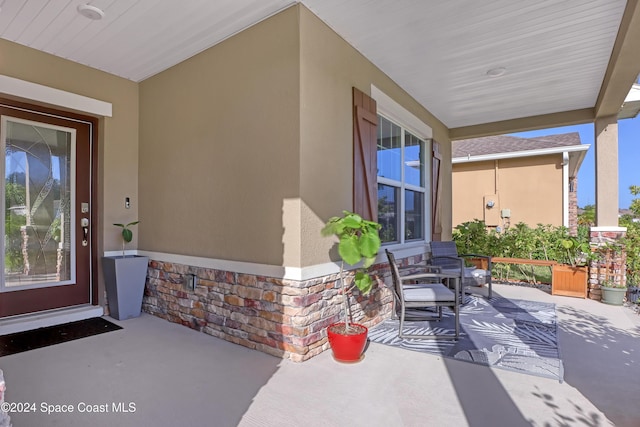 property entrance featuring covered porch