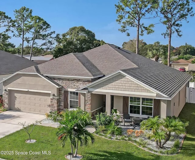 view of front of property with a garage and a front yard