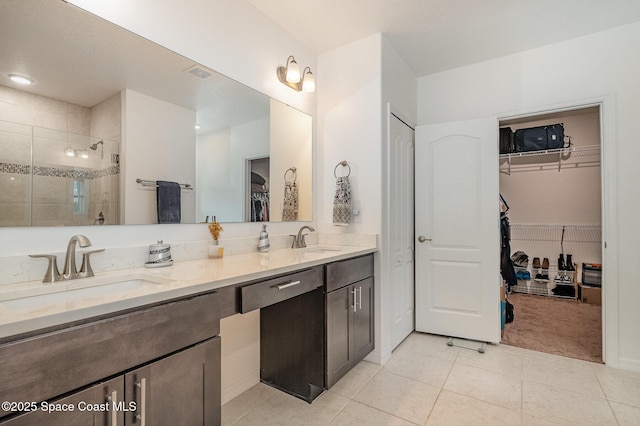 bathroom with vanity, tile patterned floors, and a shower with shower door