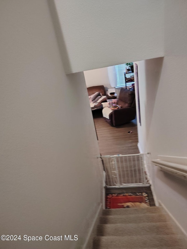 staircase featuring hardwood / wood-style floors