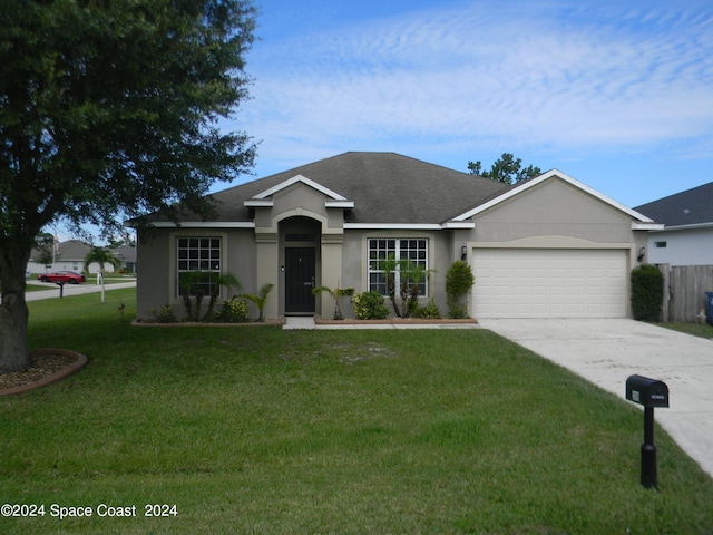 single story home featuring a front yard and a garage