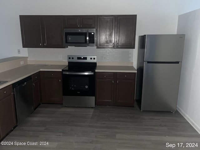 kitchen featuring decorative backsplash, dark brown cabinetry, stainless steel appliances, and light hardwood / wood-style flooring