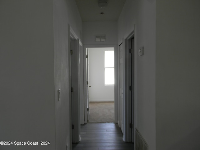 hallway featuring hardwood / wood-style flooring