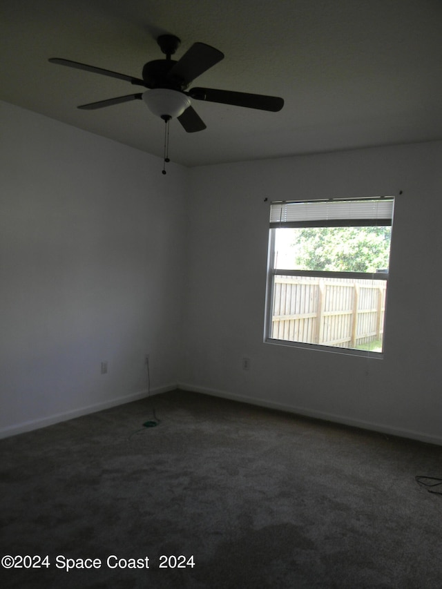 carpeted empty room with ceiling fan