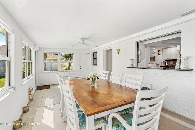 dining area with ceiling fan