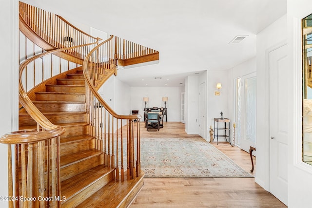 staircase featuring hardwood / wood-style floors