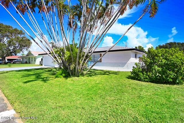 view of side of home featuring a yard