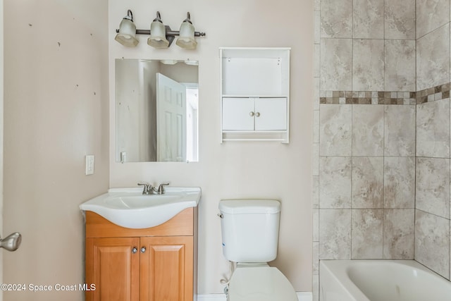 full bathroom featuring vanity, toilet, and tiled shower / bath