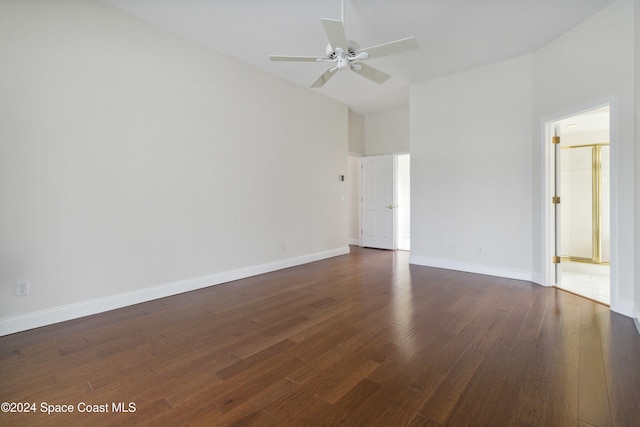 empty room featuring ceiling fan and dark hardwood / wood-style flooring