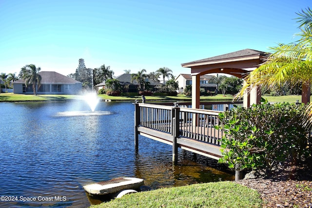 dock area with a gazebo and a water view