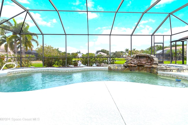 view of pool with a lanai