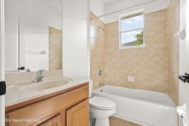 full bathroom with tile patterned flooring, tiled shower / bath combo, toilet, and vanity